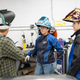 Buschkoetter giving Shaw (center) and Coté a welding tutorial.